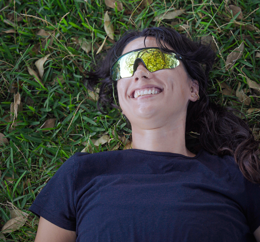woman smiling in running sunglasses
