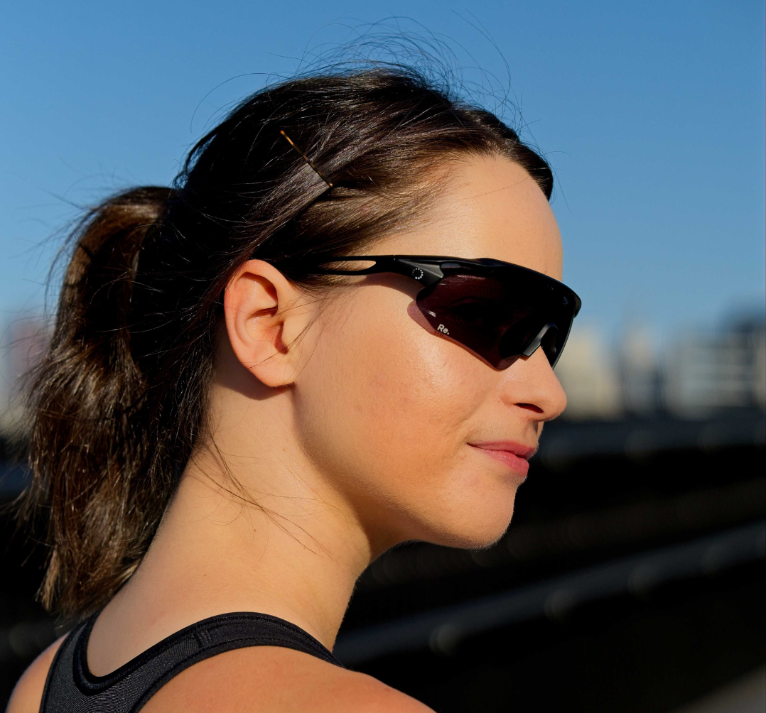 woman wearing running sunglasses