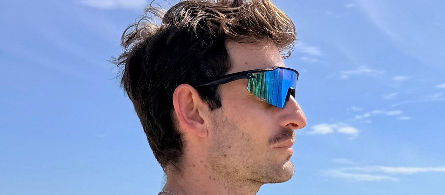 Runner training outdoors for base building, wearing Re. running sunglasses