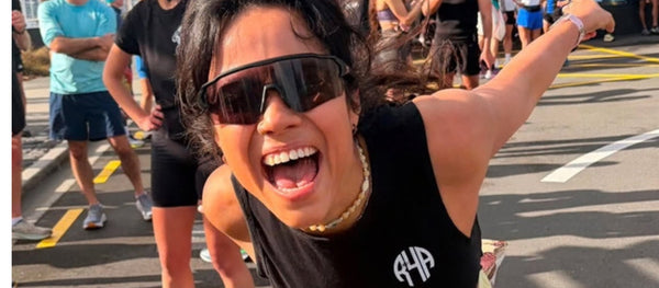Runner wearing Re. sunglasses in bright sunlight, UV eye protection for running
